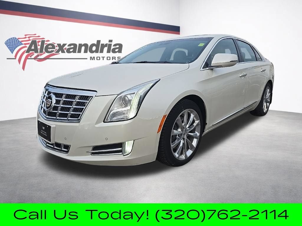 2013 Cadillac XTS Premium in White Diamond Tricoat — front three-quarter view